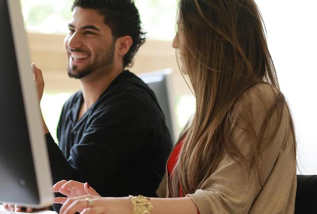 male and female student smiling
