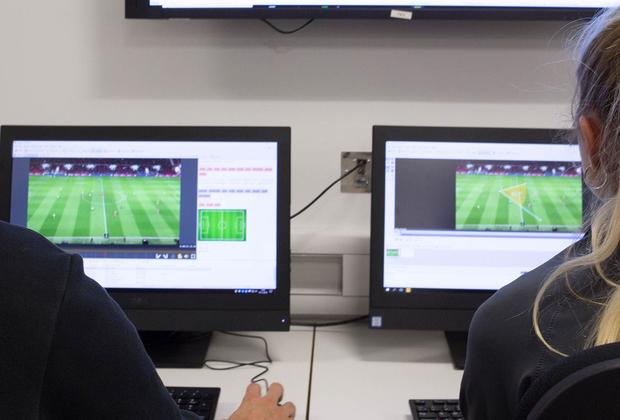 students analysing sports performances on a computer