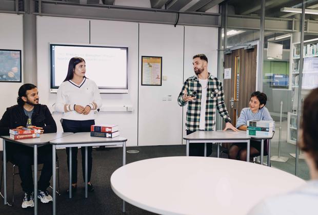 Students debating in a study room