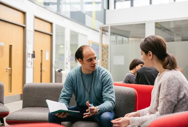 Two students talking on campus