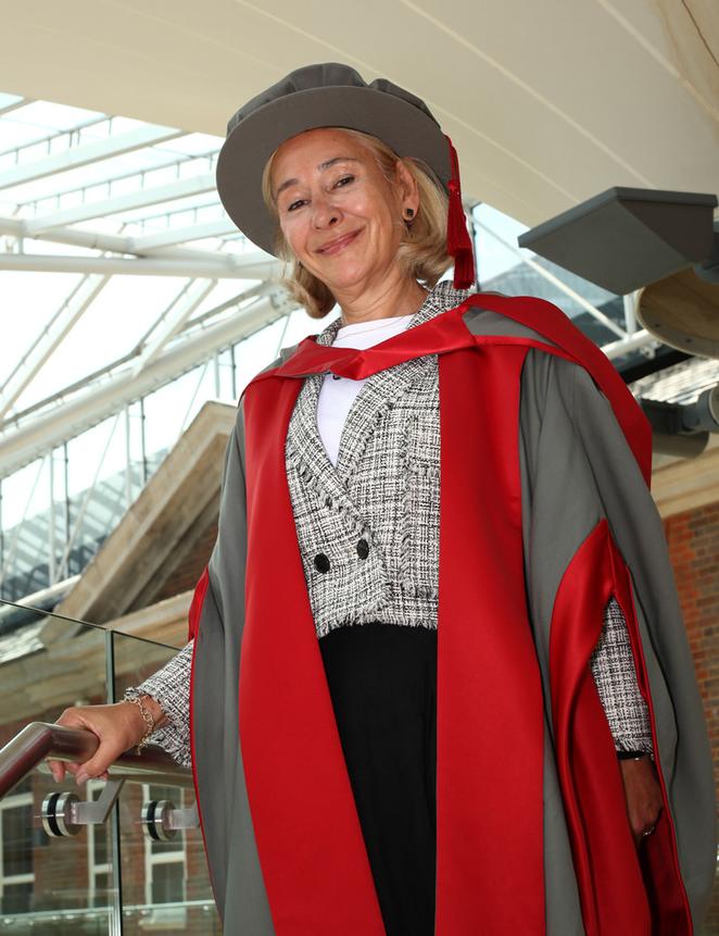 Sue Cunningham wearing a graduation robe