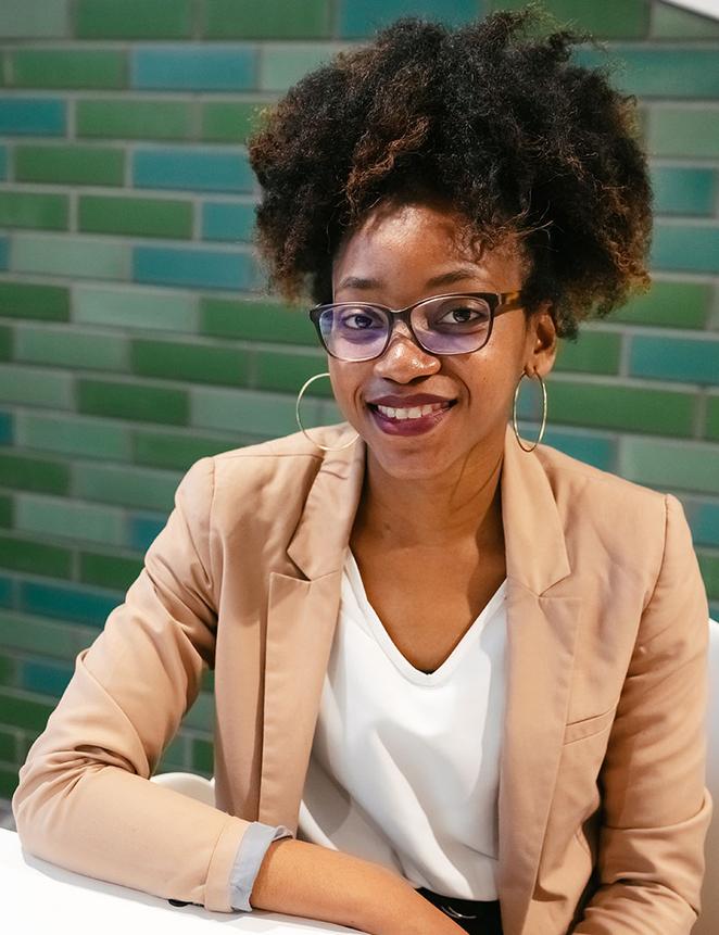 smartly-dressed student smiling