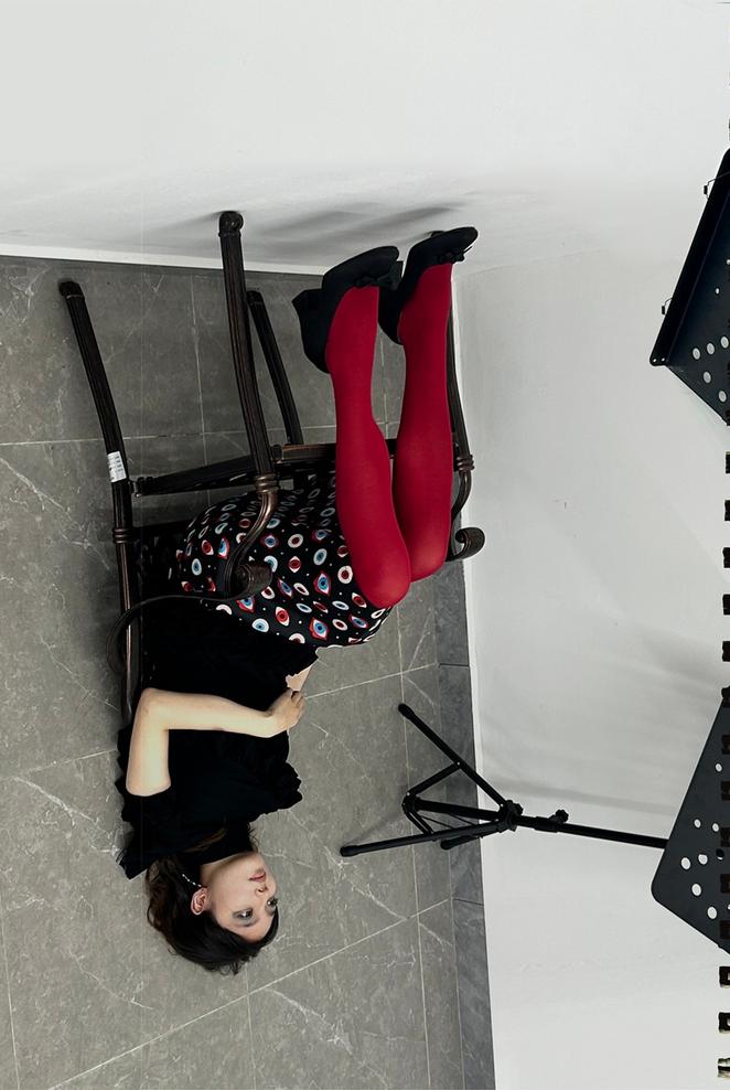 A piece of work by Chen Shuhui Miko with an upside-down depiction of a woman sitting in a chair
