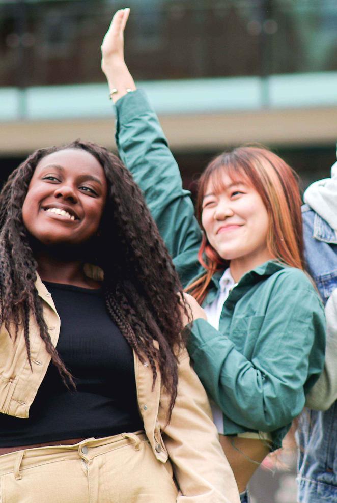 Three students on campus taking a selfie
