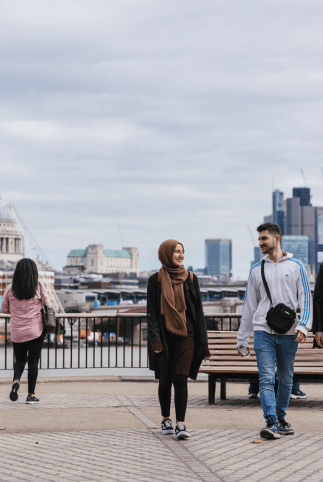 Students walking by the River, with St Pauls Cathedral and London Cityscape in the background