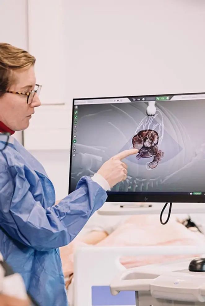 Healthcare science students looking at diagram on a screen