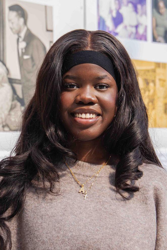 Angel - clearing student stood in art building