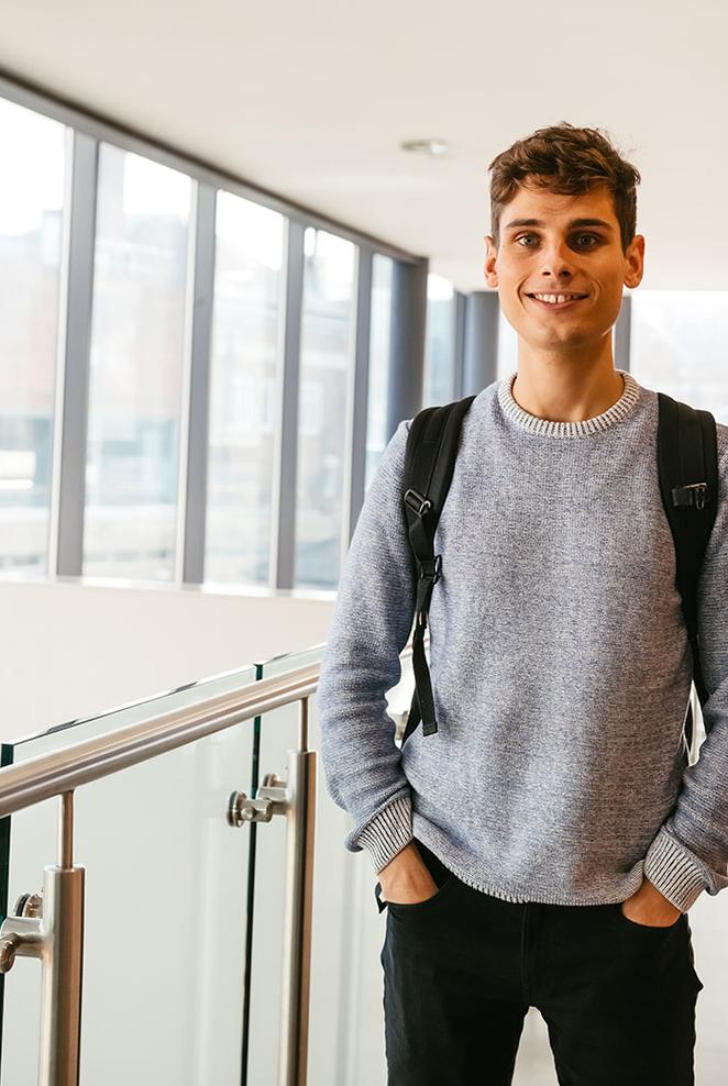 student standing in modern building