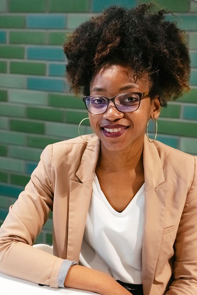 smartly-dressed student smiling