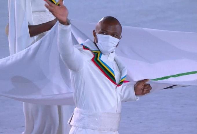 Cyrille with his national flag during the olympics