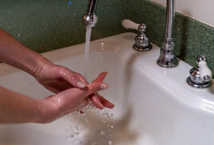 Washing hands in a sink
