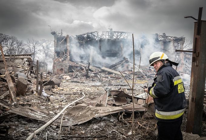 A worker is looking at a scene from Ukraine War