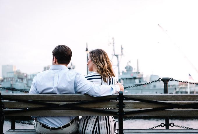 A couple sitting on a bench