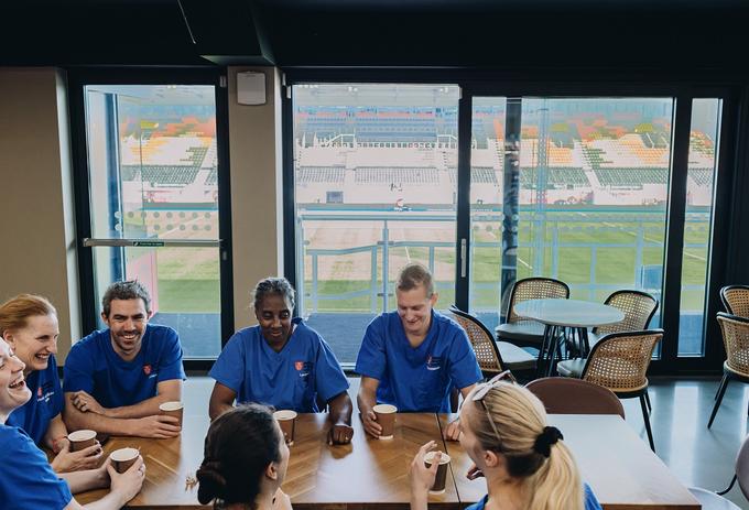 Nurses sitting roundtable West stand facility