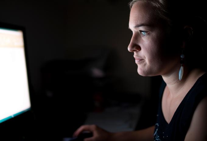 woman reading something from a computer screen