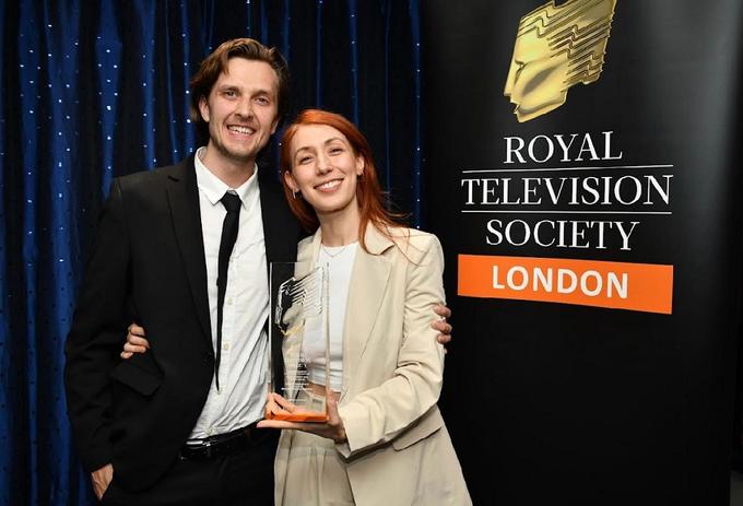 A student is celebrating an award win