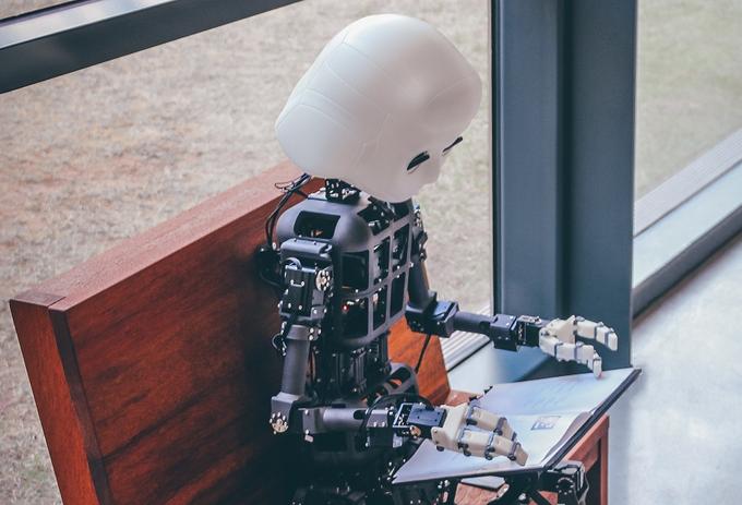 A robot with a laptop