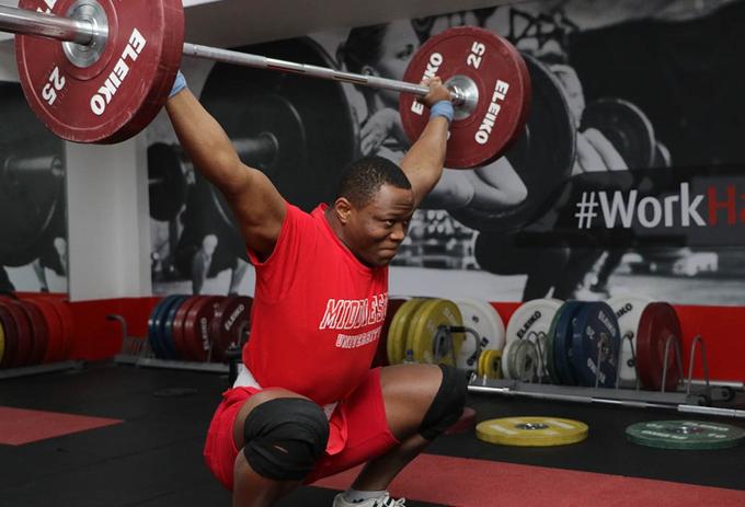 Cyrille lifting weights