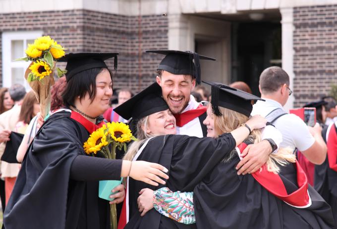Graduate group hug