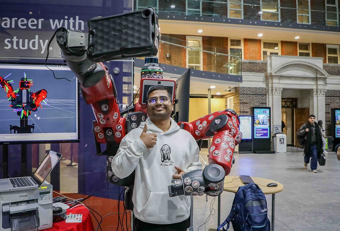 Student with Bertie selfie robot at STEM festival