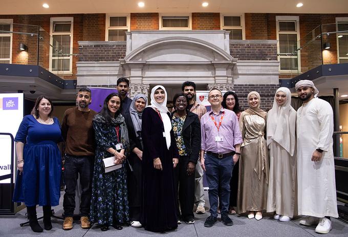 People from different faiths stood inside a university building