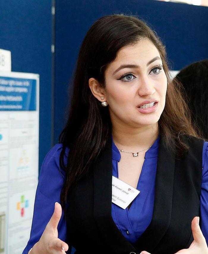 researcher giving talk at conference