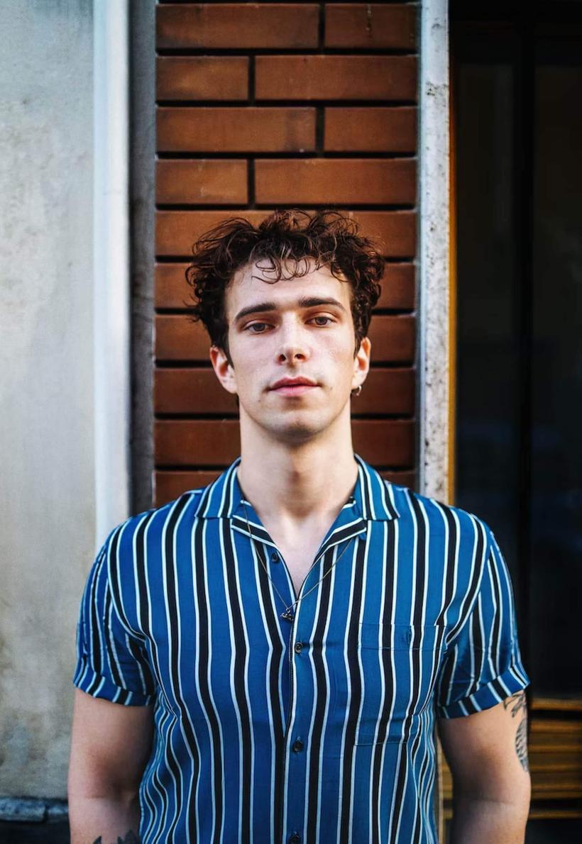 Student in blue and white striped shirt