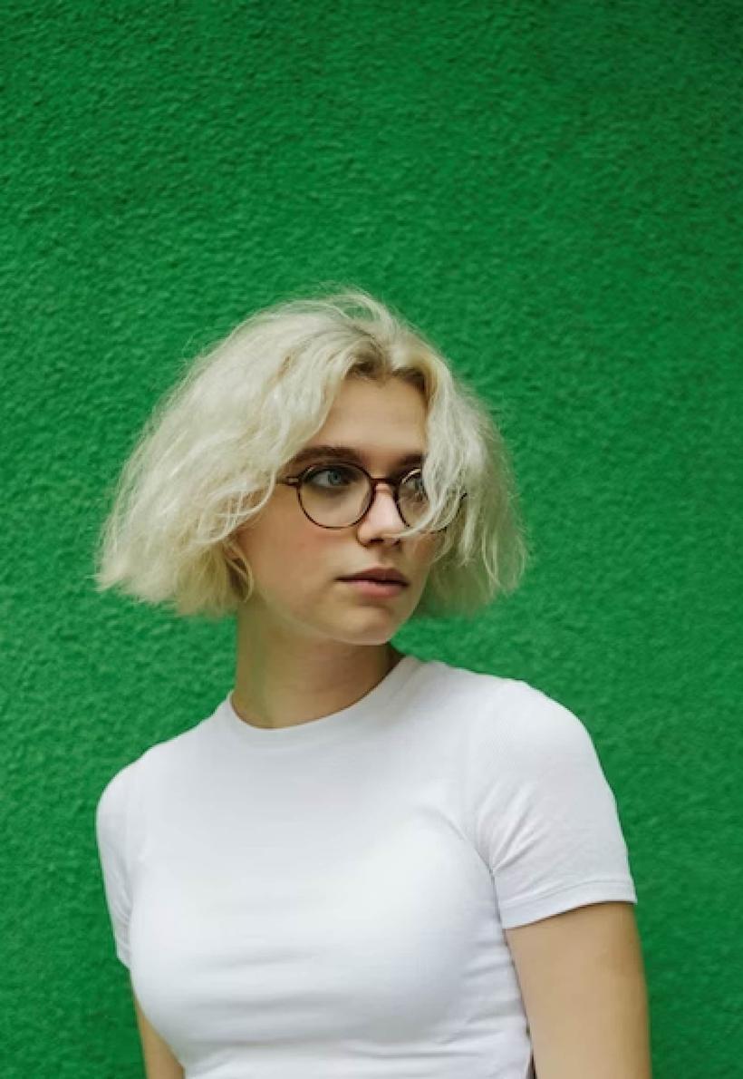 Person in front of a green background
