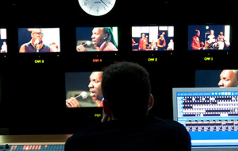 TV studio production setting with cameras showing multiple angles of a filming environment