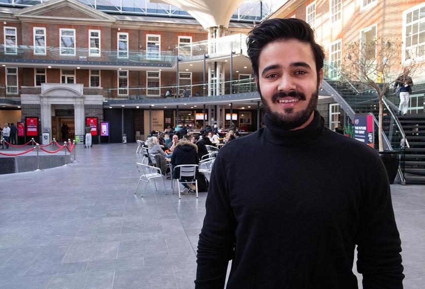 Male student in the quad building at Middlesex University