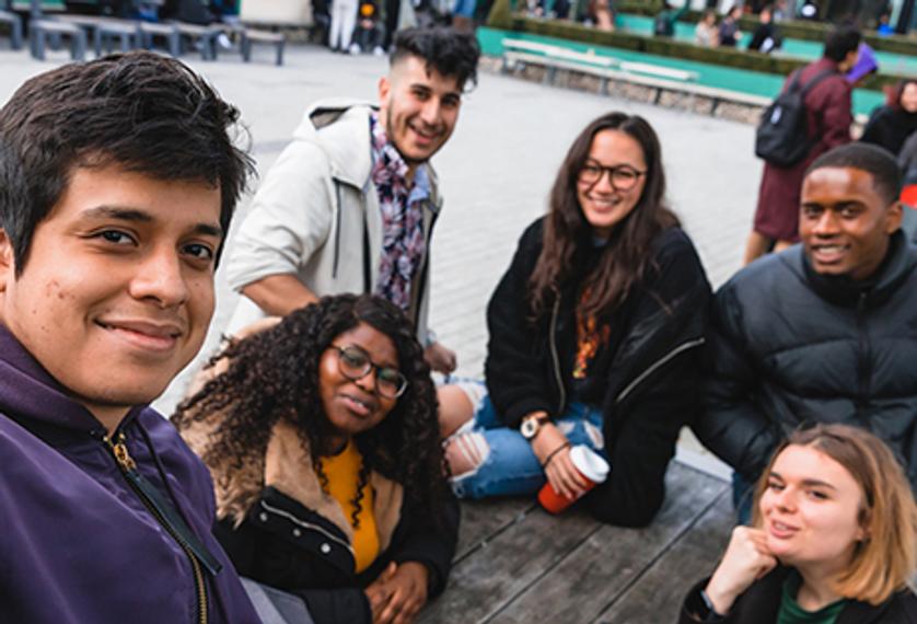 Group of students sat together on campus