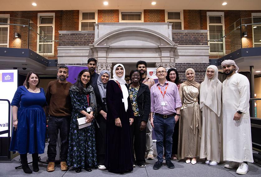 People from different faiths stood inside a university building