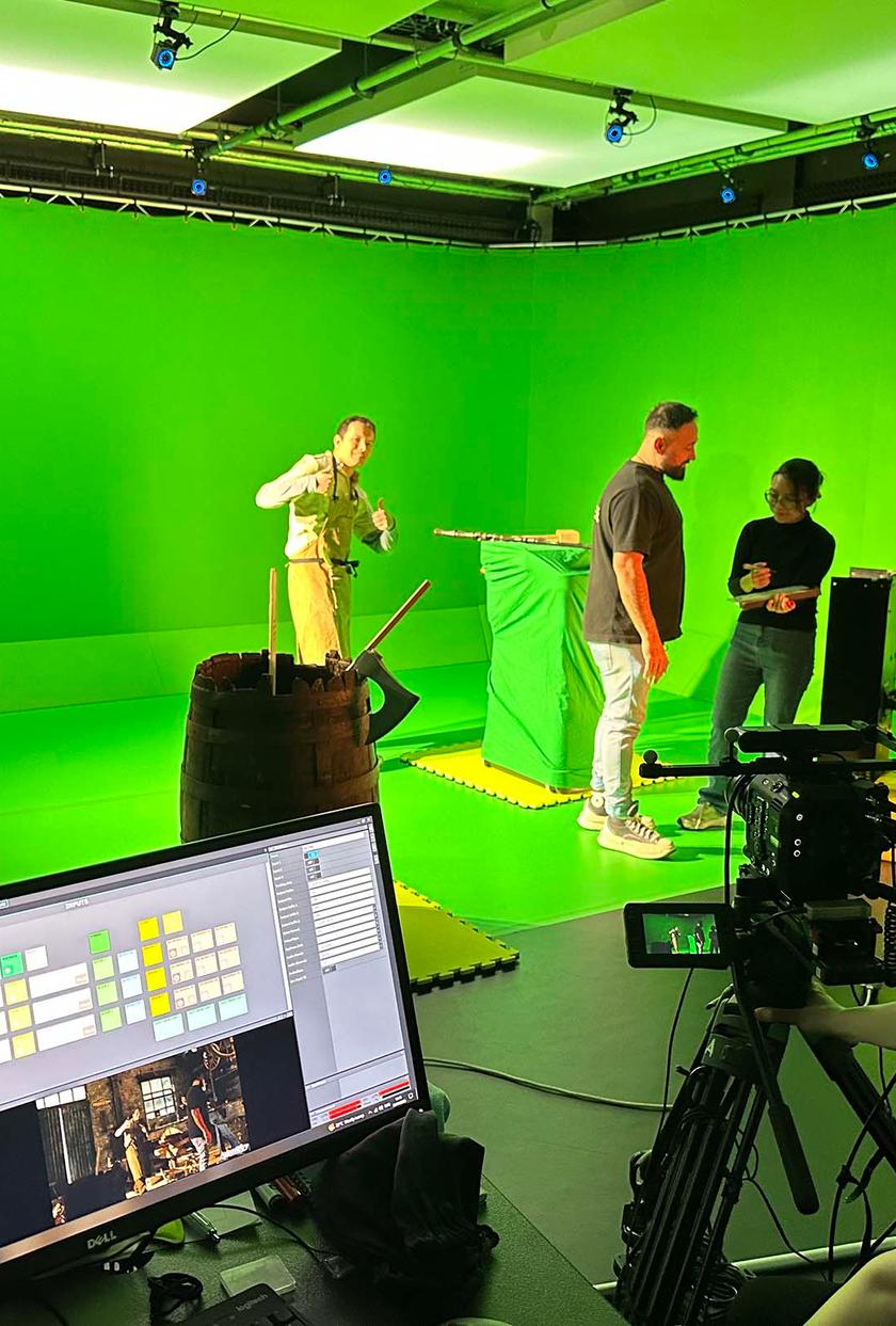 Students filming using green screen technology