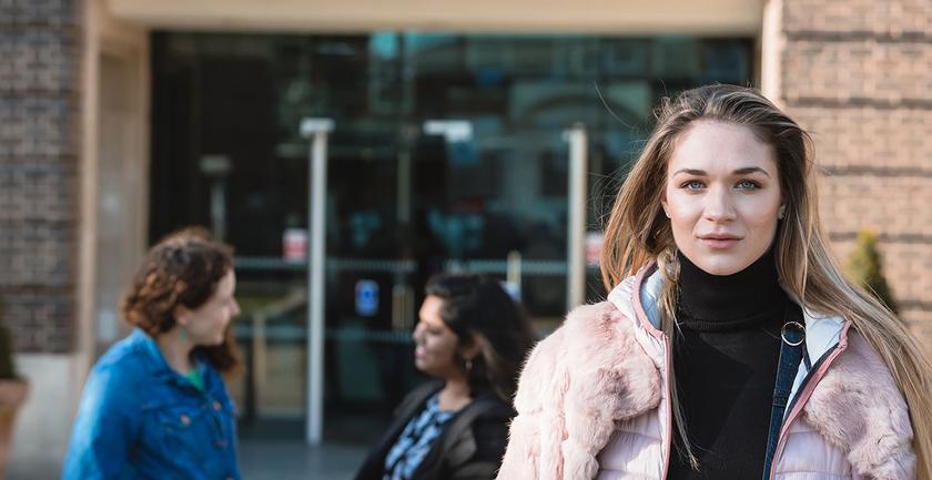 Female student stood outside campus