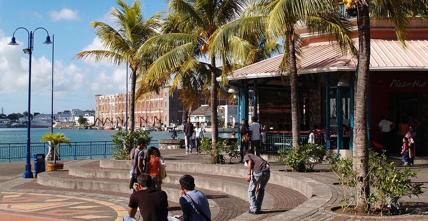 city bay on sunny day in Mauritius, with palm trees