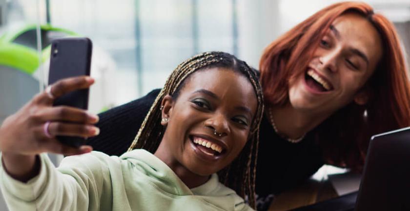 People smiling taking a selfie