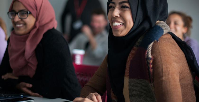 Female students wearing hijabs attending an education studies class