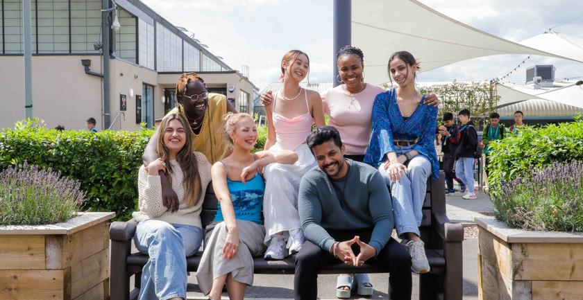 Group of students sat together on campus