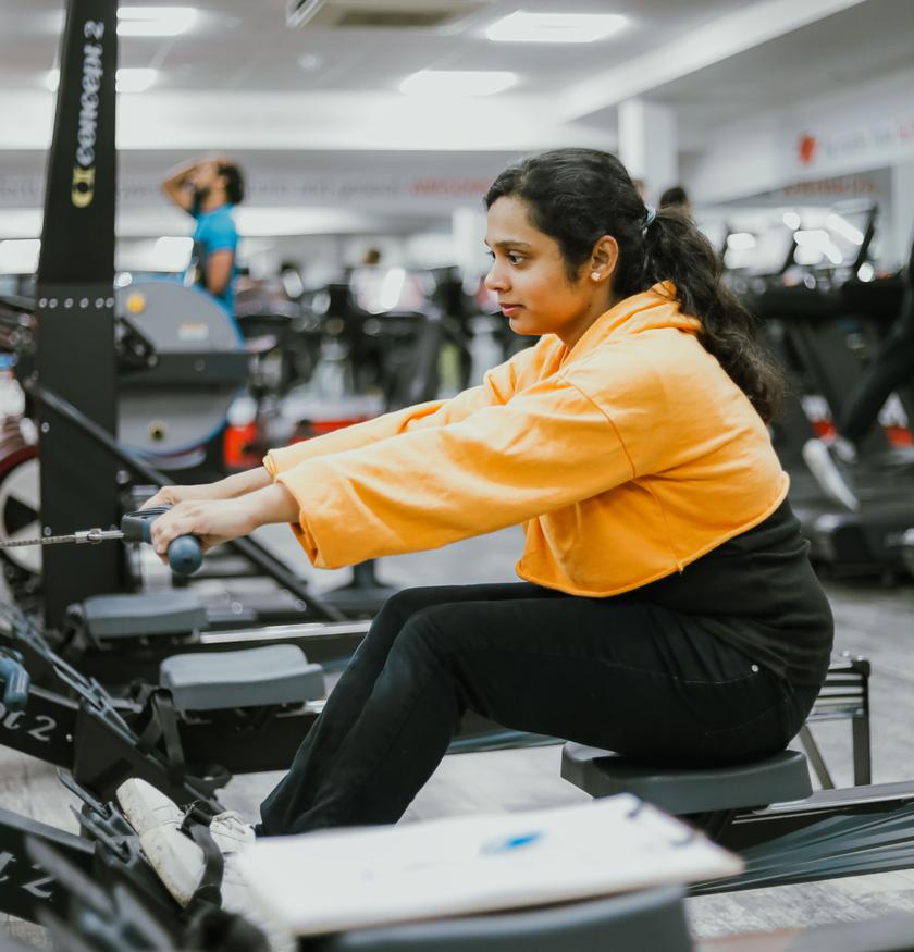 A gym goer working out in the Fitness Pod.