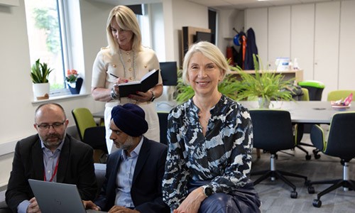 Shân Wareing with three colleagues on campus