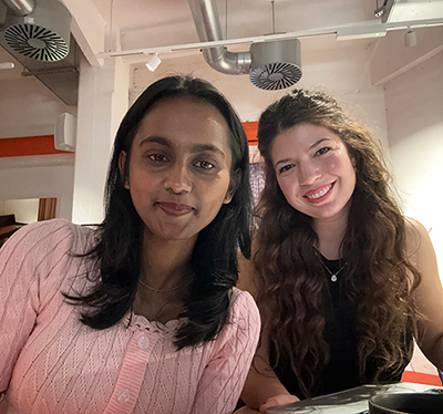 Two What A Host interns posing for a selfie