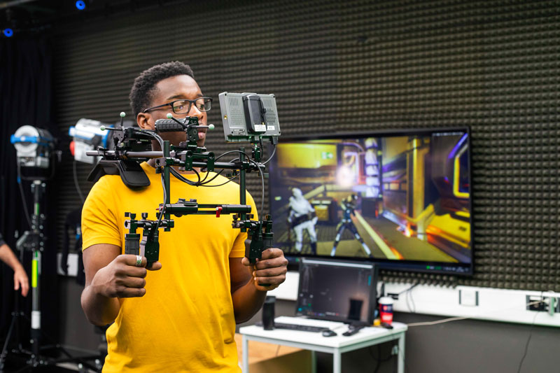 Middlesex student in action using filming equipment