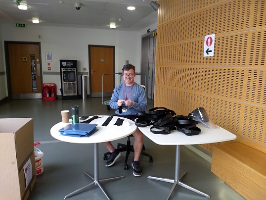 MDX colleagues assembling visors representing Team MDX's effort in creating 60,000 visors for the NHS in six weeks.