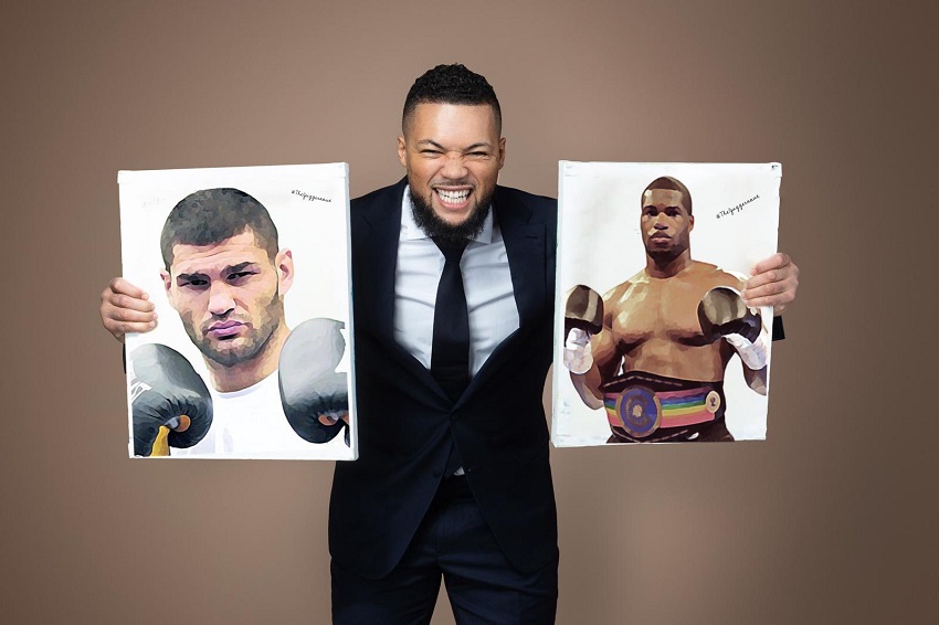 A man in formal attire displaying images of two boxing competitors.
