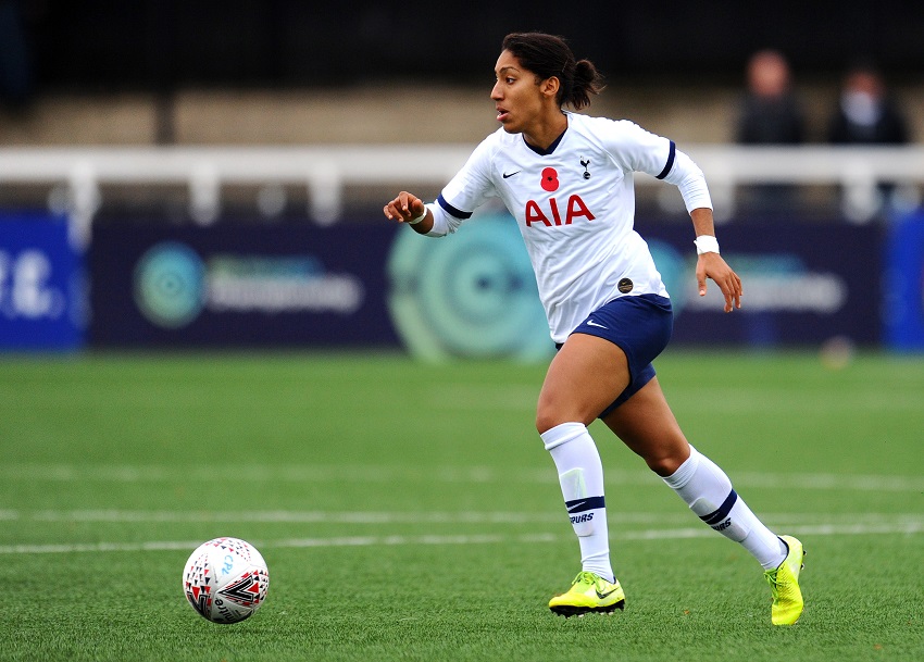 Female soccer players on the field.