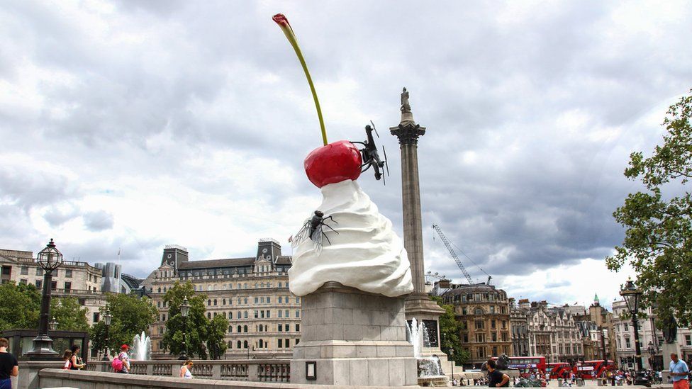 Heather Phillipson's THE END - a sculpture of a pile of whipped cream, a cherry, a drone and a fly on Fourth Plinth