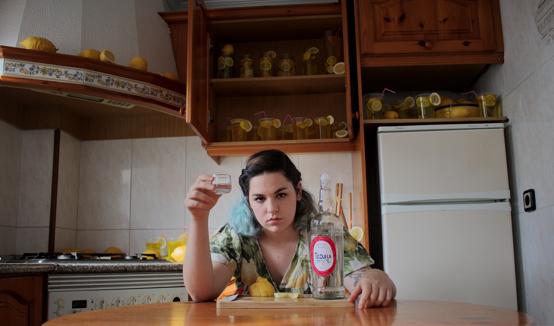 Girl sitting in a kitchen