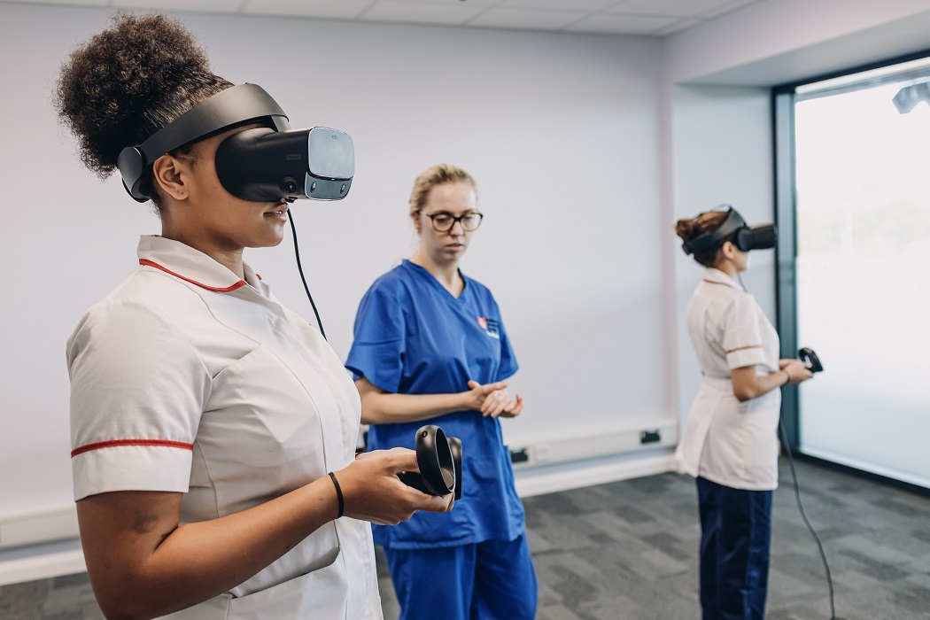 Students experiencing VR tech in West Stand health skills room