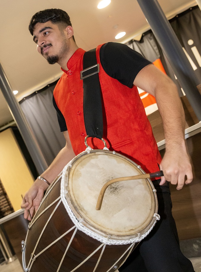 A dohl drummer performs at the Diwali celebration