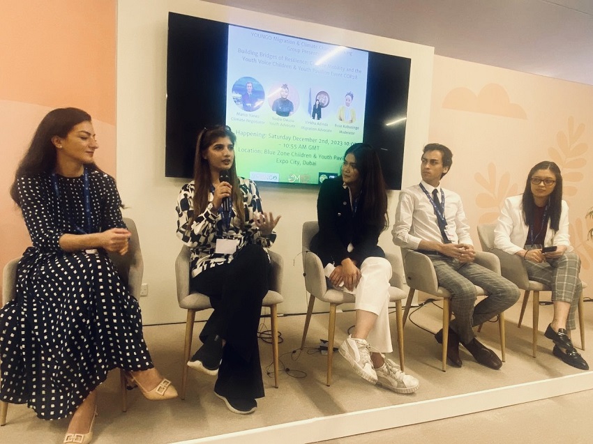 Tayba Jamil speaking at an event at COP28